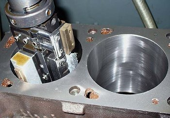 Cylinder honing including piston measurement and selection